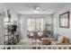 Relaxing living room with two armchairs, sofa and a coffee table at 7771 W Pipestone Pl, Phoenix, AZ 85035