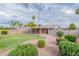 Landscaped backyard with covered patio and lawn at 8448 E Cambridge Ave, Scottsdale, AZ 85257