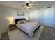 Bright bedroom with ceiling fan, double closet, and neutral decor at 8448 E Cambridge Ave, Scottsdale, AZ 85257