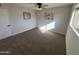 Well-lit bedroom featuring carpet floors and a ceiling fan at 8448 E Cambridge Ave, Scottsdale, AZ 85257