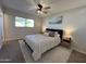 Spacious bedroom with ceiling fan, large window, and neutral decor at 8448 E Cambridge Ave, Scottsdale, AZ 85257