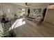 Bright living room with hardwood floors, comfy seating, and large windows at 8448 E Cambridge Ave, Scottsdale, AZ 85257