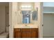 Bathroom features a vanity with wood cabinets and a mirror at 850 S River Dr # 1092, Tempe, AZ 85281