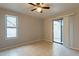 Bright bedroom with tile floors, ceiling fan, and sliding door to patio at 850 S River Dr # 1092, Tempe, AZ 85281