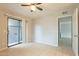 Bedroom with patio access, tile floors and ceiling fan at 850 S River Dr # 1092, Tempe, AZ 85281