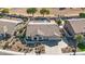 Aerial view of single-story home with a two-car garage and backyard pool at 8729 W Tonopah Dr, Peoria, AZ 85382
