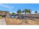Relaxing backyard with a freeform pool, covered patio, and lush landscaping at 8729 W Tonopah Dr, Peoria, AZ 85382