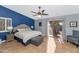 Spacious primary bedroom with patio access and ceiling fan at 8729 W Tonopah Dr, Peoria, AZ 85382