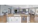 Island kitchen with granite countertops and stainless steel appliances at 8729 W Tonopah Dr, Peoria, AZ 85382