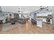 Open floor plan with island kitchen and gray sectional sofa at 8729 W Tonopah Dr, Peoria, AZ 85382