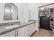 Bathroom with double vanity and a large mirror at 10428 S 294Th Ave, Palo Verde, AZ 85343