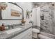 Clean bathroom with granite countertop, white cabinets, and a tiled shower at 10428 S 294Th Ave, Palo Verde, AZ 85343