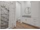 Modern bathroom with a walk-in shower and granite countertop at 10428 S 294Th Ave, Palo Verde, AZ 85343