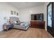 Charming bedroom with a tufted headboard, nightstand, and decorative art at 10428 S 294Th Ave, Palo Verde, AZ 85343