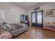 Bedroom with double doors and wood flooring at 10428 S 294Th Ave, Palo Verde, AZ 85343