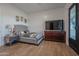 Bedroom with wood floors and a dresser at 10428 S 294Th Ave, Palo Verde, AZ 85343