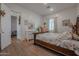 Bedroom with wood floors and a walk-in closet at 10428 S 294Th Ave, Palo Verde, AZ 85343