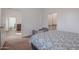 Bright bedroom with a queen bed and views into another room at 10428 S 294Th Ave, Palo Verde, AZ 85343