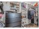 Spacious walk-in closet with ample shelving and hanging space at 10428 S 294Th Ave, Palo Verde, AZ 85343