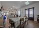 Open concept dining area with kitchen and entryway views at 10428 S 294Th Ave, Palo Verde, AZ 85343