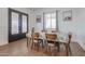 Bright dining room features a wood table and six chairs at 10428 S 294Th Ave, Palo Verde, AZ 85343