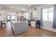 Modern kitchen with white cabinets, granite island, and stainless steel appliances at 10428 S 294Th Ave, Palo Verde, AZ 85343