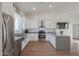 Open concept kitchen with granite countertops and stainless steel appliances at 10428 S 294Th Ave, Palo Verde, AZ 85343