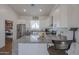 Bright kitchen featuring ample cabinet space and an island at 10428 S 294Th Ave, Palo Verde, AZ 85343