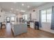 Modern kitchen with large island, white cabinets and granite at 10428 S 294Th Ave, Palo Verde, AZ 85343