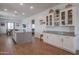 Open concept kitchen with white cabinets and granite counters at 10428 S 294Th Ave, Palo Verde, AZ 85343