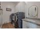 Laundry room with washer, dryer, and granite countertop at 10428 S 294Th Ave, Palo Verde, AZ 85343