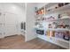 Laundry room with washer, dryer, and ample shelving at 10428 S 294Th Ave, Palo Verde, AZ 85343