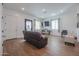 Bright living room with hardwood floors and comfy seating at 10428 S 294Th Ave, Palo Verde, AZ 85343