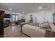 Main bedroom with sitting area and double doors at 10428 S 294Th Ave, Palo Verde, AZ 85343