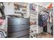 Large walk-in closet with shelving and drawers at 10428 S 294Th Ave, Palo Verde, AZ 85343