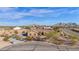 Aerial view of a single-story house with a large yard and mountain views at 12692 W Toltec Cir, Casa Grande, AZ 85194