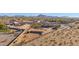 Aerial view showcasing a large lot, house, and surrounding desert landscape at 12692 W Toltec Cir, Casa Grande, AZ 85194