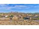 Aerial view of a property with mountain views and surrounding desert landscape at 12692 W Toltec Cir, Casa Grande, AZ 85194