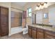 Bathroom with granite countertop, large bathtub, and modern fixtures at 12692 W Toltec Cir, Casa Grande, AZ 85194