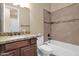 Well-lit bathroom featuring granite vanity and tiled shower/tub at 12692 W Toltec Cir, Casa Grande, AZ 85194