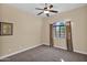 Bedroom with ceiling fan, carpet, and large window with curtains at 12692 W Toltec Cir, Casa Grande, AZ 85194