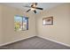 Bedroom with large window and carpet flooring at 12692 W Toltec Cir, Casa Grande, AZ 85194