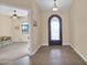 Home entryway with tile flooring and arched door at 12692 W Toltec Cir, Casa Grande, AZ 85194