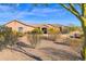 House exterior featuring a stone facade and desert landscaping at 12692 W Toltec Cir, Casa Grande, AZ 85194