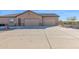 View of a two-car garage and side yard at 12692 W Toltec Cir, Casa Grande, AZ 85194