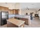 Kitchen with island, granite counters & view into living room at 12692 W Toltec Cir, Casa Grande, AZ 85194