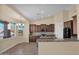 Eat-in kitchen boasting granite counters and ample cabinet space at 12692 W Toltec Cir, Casa Grande, AZ 85194