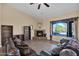 Living room features a fireplace, built-in shelves, and large windows at 12692 W Toltec Cir, Casa Grande, AZ 85194