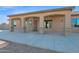 Covered patio with stone pillars and access to backyard at 12692 W Toltec Cir, Casa Grande, AZ 85194