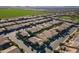 Aerial view of a luxury residential neighborhood with modern homes and a golf course at 1397 E Verde Blvd, Queen Creek, AZ 85140